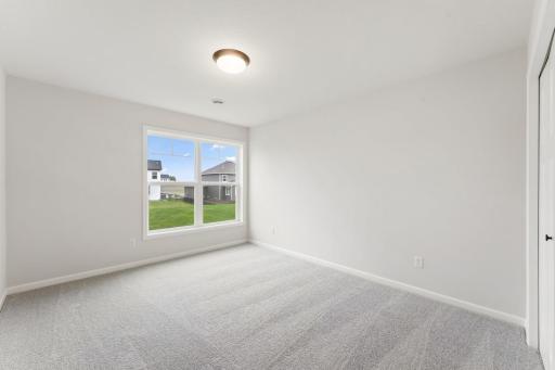 Need a space for guests? This home features another perfectly sized bedroom.