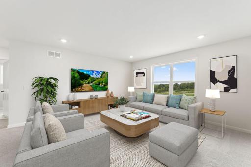 For representational purposes only. The family room is spacious and has large windows to allow natural light to pour into the home. (model photo)