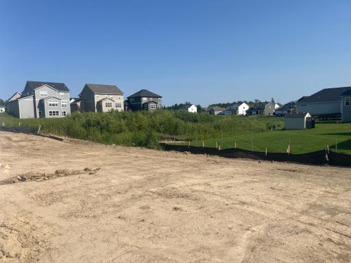The back yard has this gorgeous wetland view and the finished walkout basement makes for the ideal yard space to enjoy outdoor living.