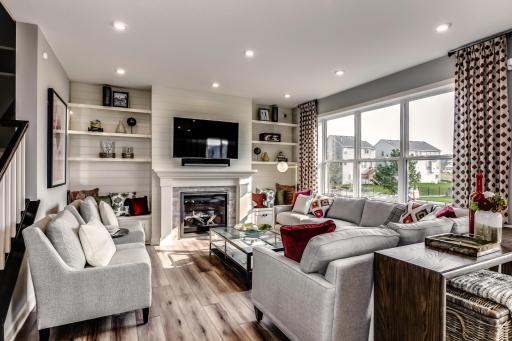 The family room has a number of large windows adding to the natural light of the main level. (model photo)