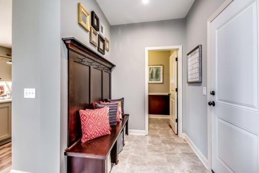 The mudroom is perfect for built in cubbies, hooks and benches. An ideal location to keep seasonal gear organized. (model photo)