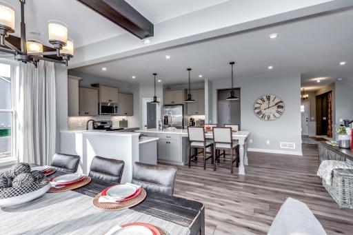 The kitchen flows seamlessly to the dining and morning room. (model photo)