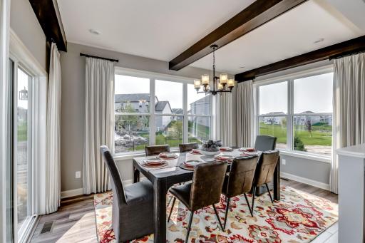 Another view of the morning room that adds additional natural light to the main level. (model photo)