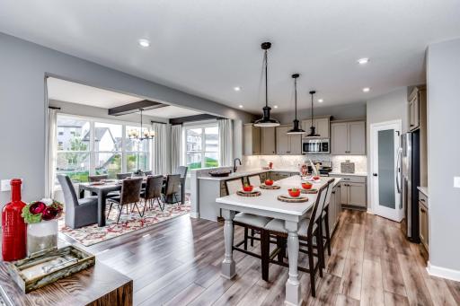 The kitchen is such a gathering place for todays households and this home delivers as the ideal place to host family and guests alike. (model photo)