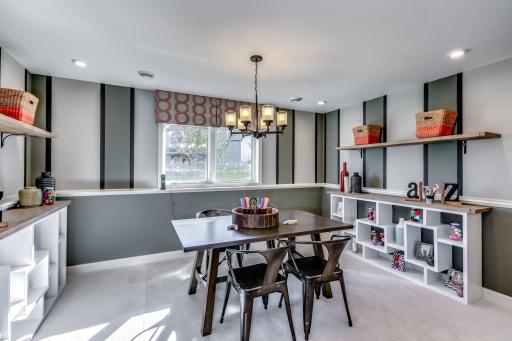 Another view of the finished lower level, the morning room space continues in the lower level which makes a spacious basement have even more wow factor! (model photo)
