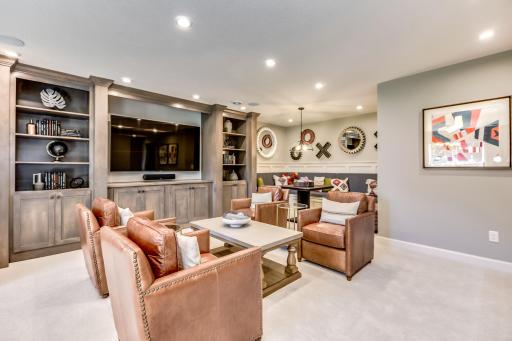 The lower level rec room is ideal for games, movies or a poker night! (model photo)