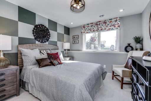 Need a space for guests? This home features another perfectly sized bedroom located in the finished lower level. (model photo)