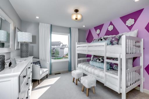 The upper level bedrooms feature large windows for natural night and perfect sized closets for storage. (model photo)