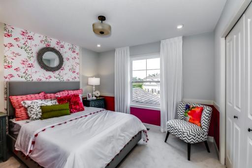 This home features perfectly sized bedrooms along with the owner's suite on the upper level. (model photo)
