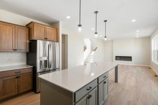 The seamless flow between the kitchen and family room creates an ideal layout for both everyday living and effortless entertaining.