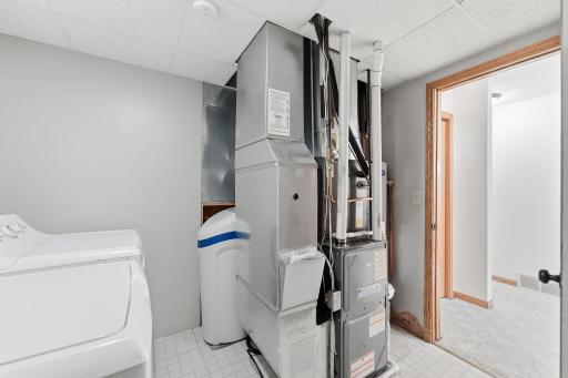 Laundry room doubles as the mechanical room.