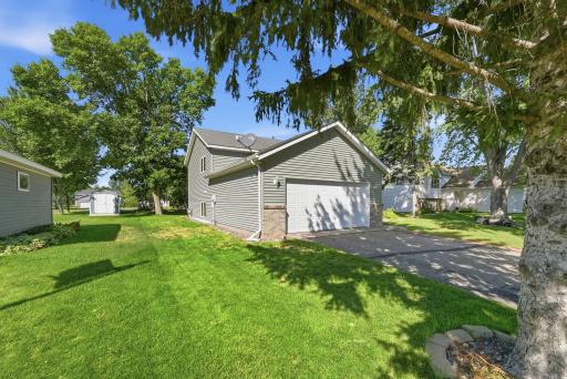 Driveway accommodates multiple vehicles.