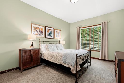 An abundance of light offers an airy feel to this primary bedroom