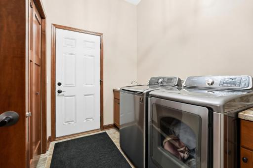 The main floor mudroom features the laundry space, utility sink, large storage & closet space. Ideal location.