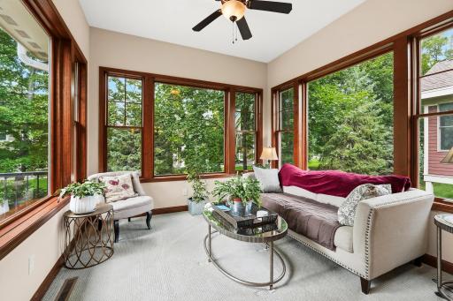 This four season porch is a "10", great space for relaxing, reading or listening to music. Bright & airy, you won't be disappointed. Easy access to the maintenance free deck.