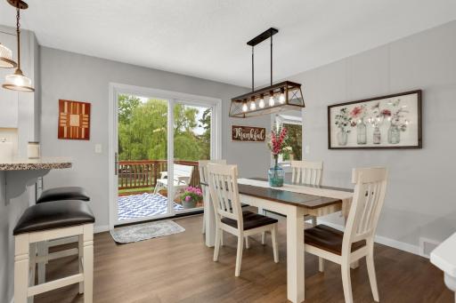 Dining area opens directly to the deck, making indoor-outdoor entertaining easy.
