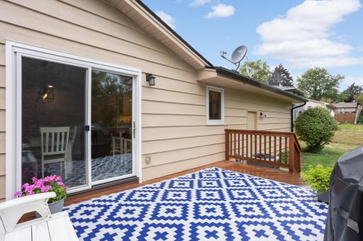 Sliding glass doors off the dining area lead directly to the backyard deck for easy indoor-outdoor living.
