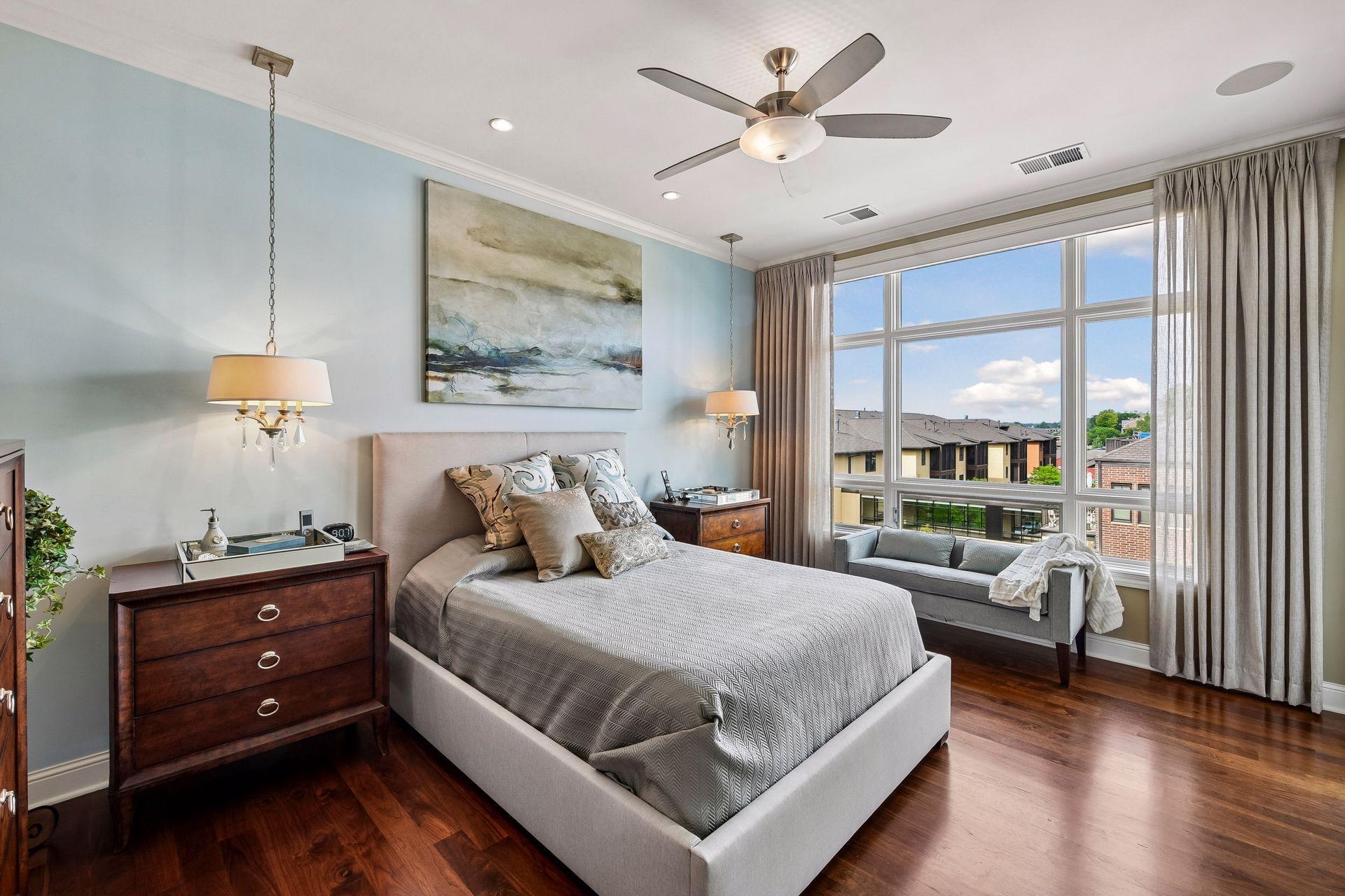 Step into the luxurious primary bedroom with access to the second balcony facing west