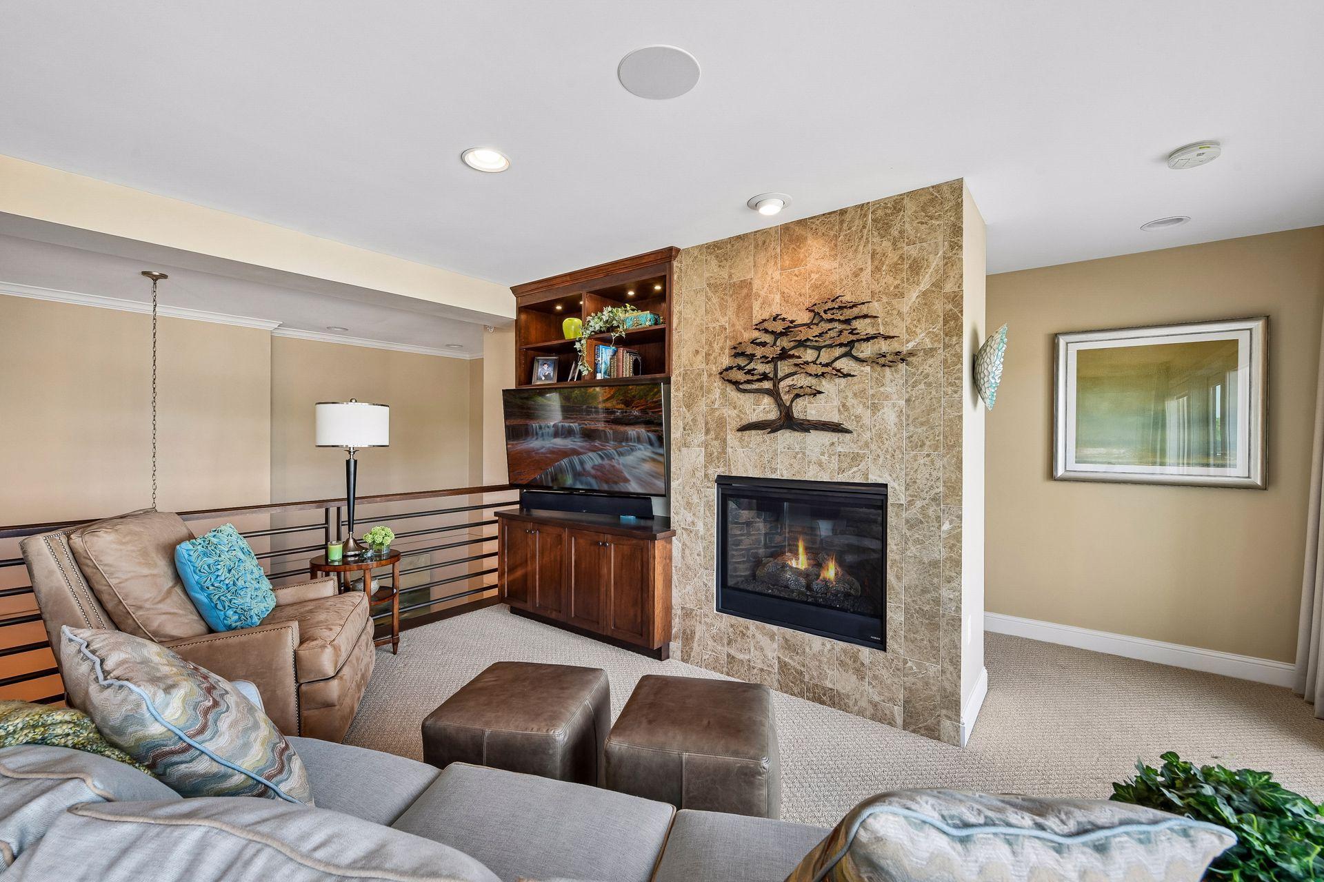 Beautiful gas fireplace and room for seating in this upper level
