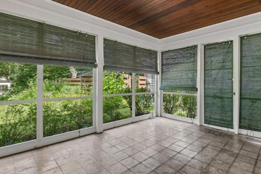 Relax on the 20 x 10 screened porch while enjoying views of the lush backyard, an inviting space for morning coffee, quiet evenings, or entertaining.