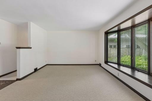 Just beyond the living room, a private hallway leads to the home's two main-level bedrooms and full bath.