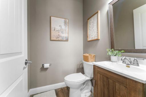 Conveniently located on the main level, the powder room is easily accessible for guests and everyday living.