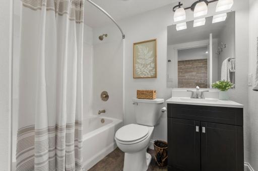 A full bathroom conveniently serves the lower level.