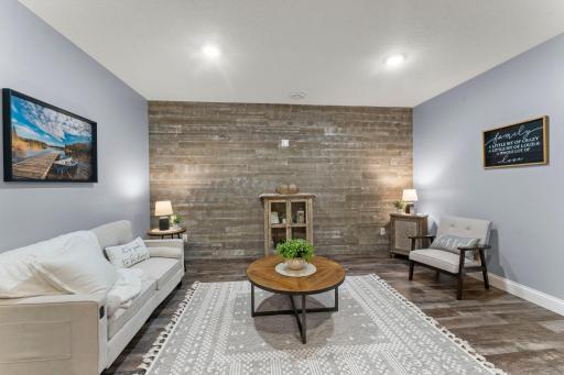 A family room with a wood-plank accent wall that instantly elevates the space.