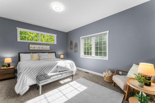 Overlooking the back and side yard with a spacious walk-in closet.