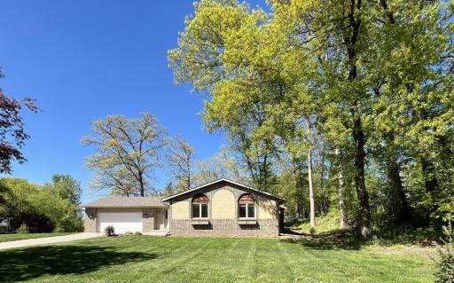 Brick front, larger corner lot, mature trees