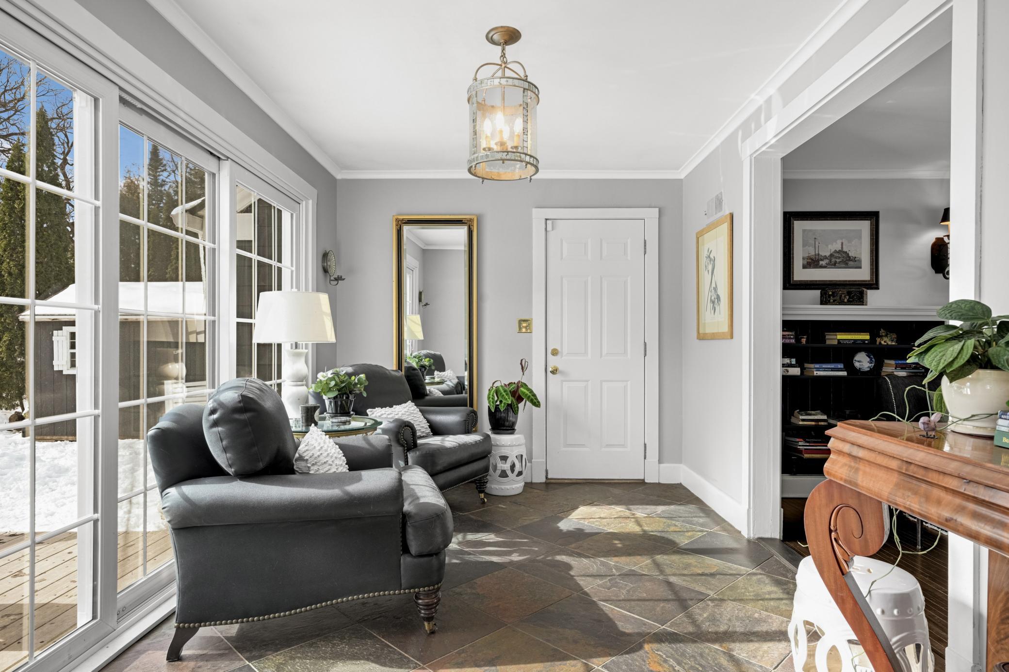 Sunroom and entrance to attached garage
