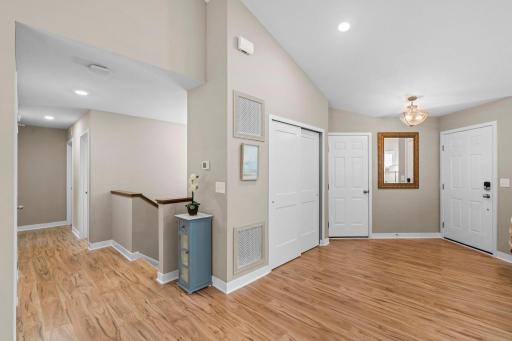 The view of the entryway, hallway, and stairwell to the lower level. 1515 138th St E, Rosemount, MN