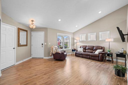 Another view of the entryway and living room with lots of natural light. 1515 138th St E, Rosemount, MN