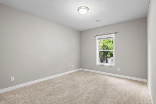 This lower level bedroom looks out onto the lovely backyard. 1515 138th St E, Rosemount, MN