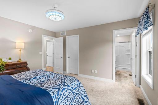 The Primary bedroom looking into the private bathroom. 1515 138th St E, Rosemount, MN