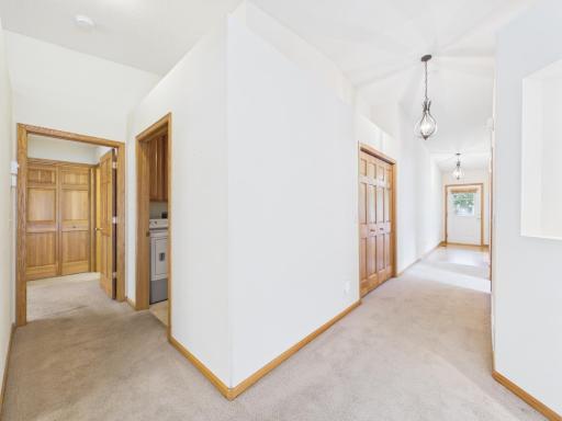 View of the front hallway-right and the primary bedroom left.