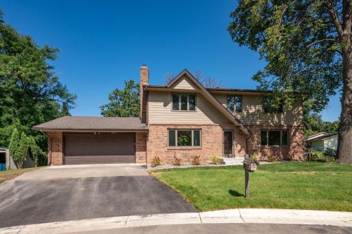 Classic 2-story home on a cul-de-sac lot with brick and cement board exterior plus updated windows throughout!