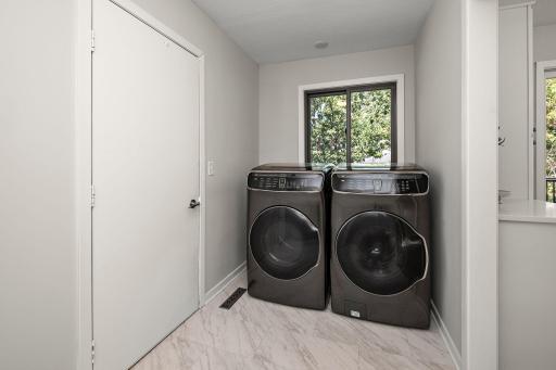 Upgraded washer and dryer in the mud room! (not pictured is space on the other side of the room for cabinets, cubbies, or whatever your vision is for mudroom storage!)