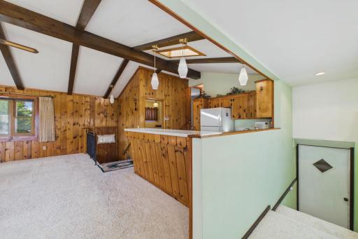Stairs leading to storage and family room