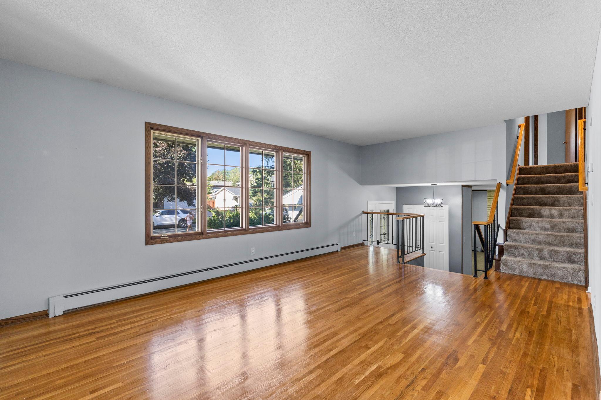 Beautiful hardwood floors add warmth and character to the living room