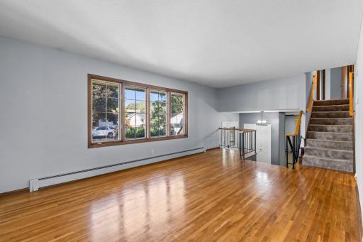 Beautiful hardwood floors add warmth and character to the living room