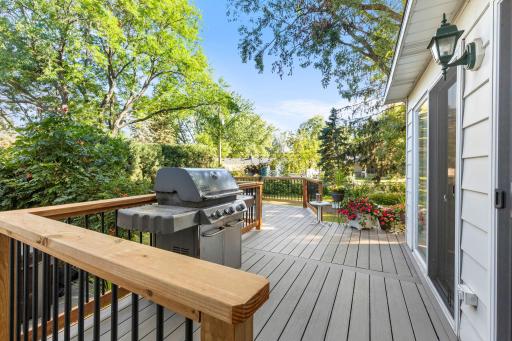 Enjoy easy indoor-outdoor flow with a maintenance-free wraparound deck leading from the porch to a tucked-away sitting area