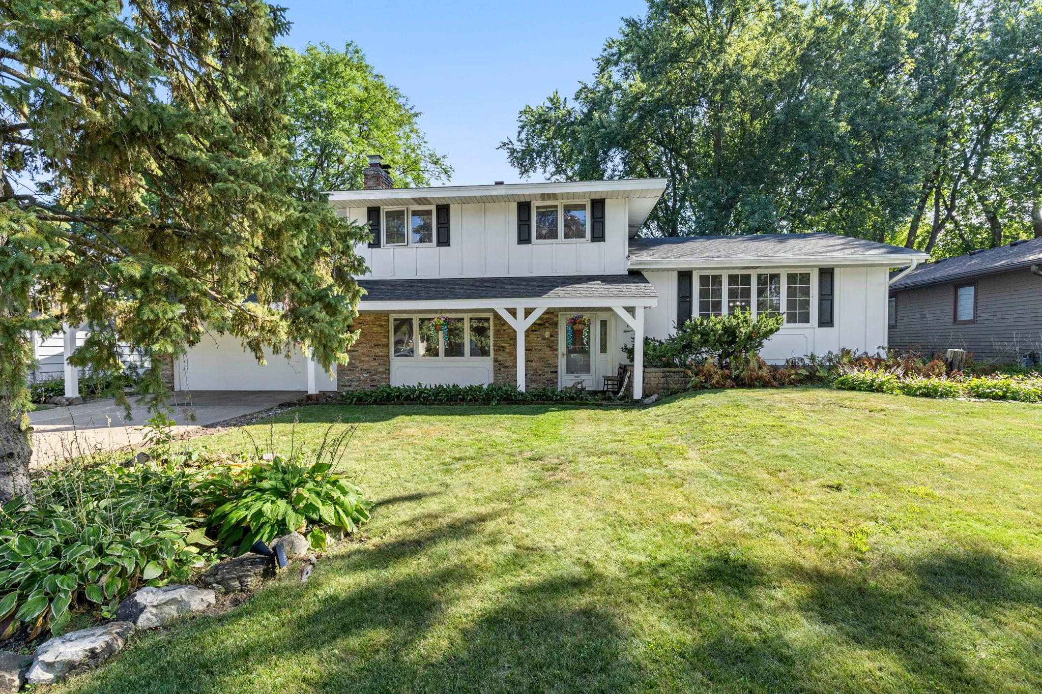 Beautiful Shoreview four-level split with mature landscaping and wonderful curb appeal