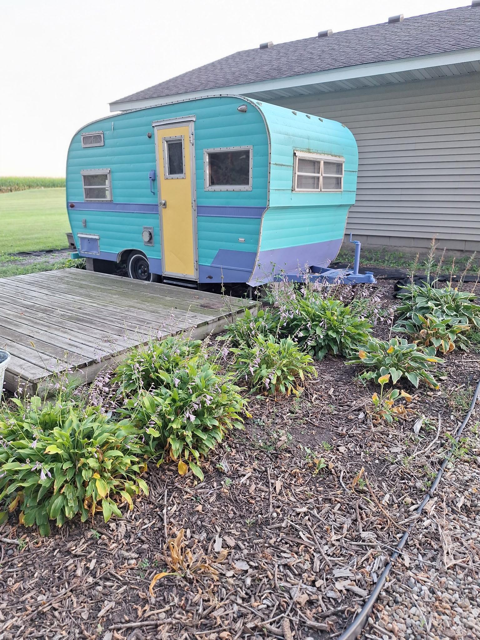 Behind 2nd garage. Small camper, deck patio and firepit