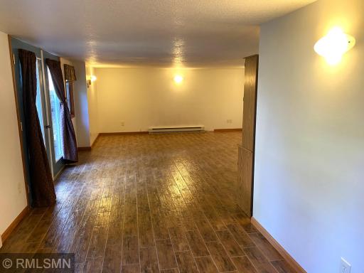 Lower-Level Bedroom Suite Wood Pattern Ceramic Tile