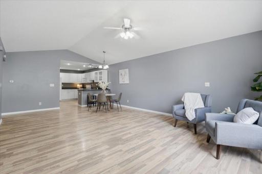 The spacious living room offers plenty of flexibility with a comfortable layout and an easy connection to the kitchen and dining space.