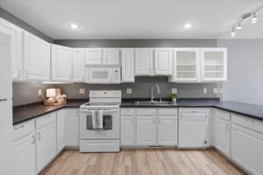 A kitchen with plenty of space. Lots of cabinets and counter space give you room to cook, prep and gather.