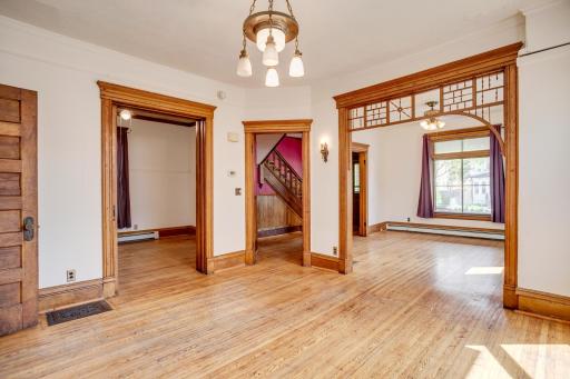 Formal dining room view into living room and study/bedroom.
