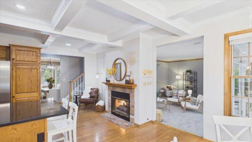 Cozy dual sided fireplace in the kitchen and family