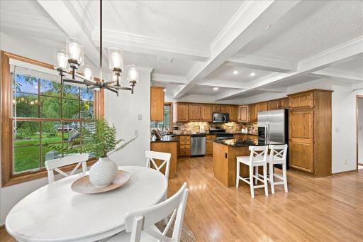 Natural wood cabinetry pops with the white ceiling